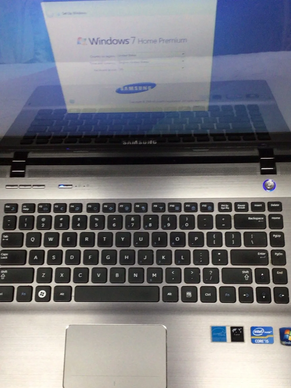 Samsung Silver and Black Laptop with Windows 7 Setup Screen